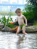 A little boy on the river.